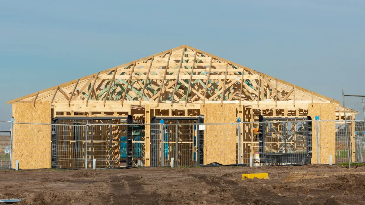 Roof trusses and wall framing mid-build