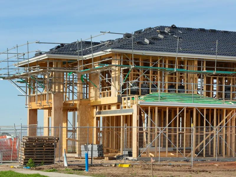 Two-story home addition framed in lumber with scaffolding