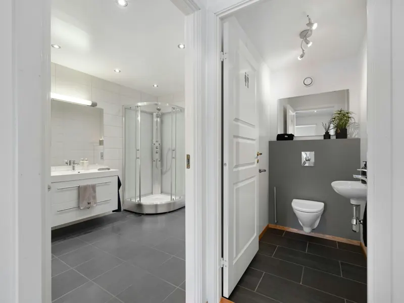 Remodeled bathroom with vanity and corner shower